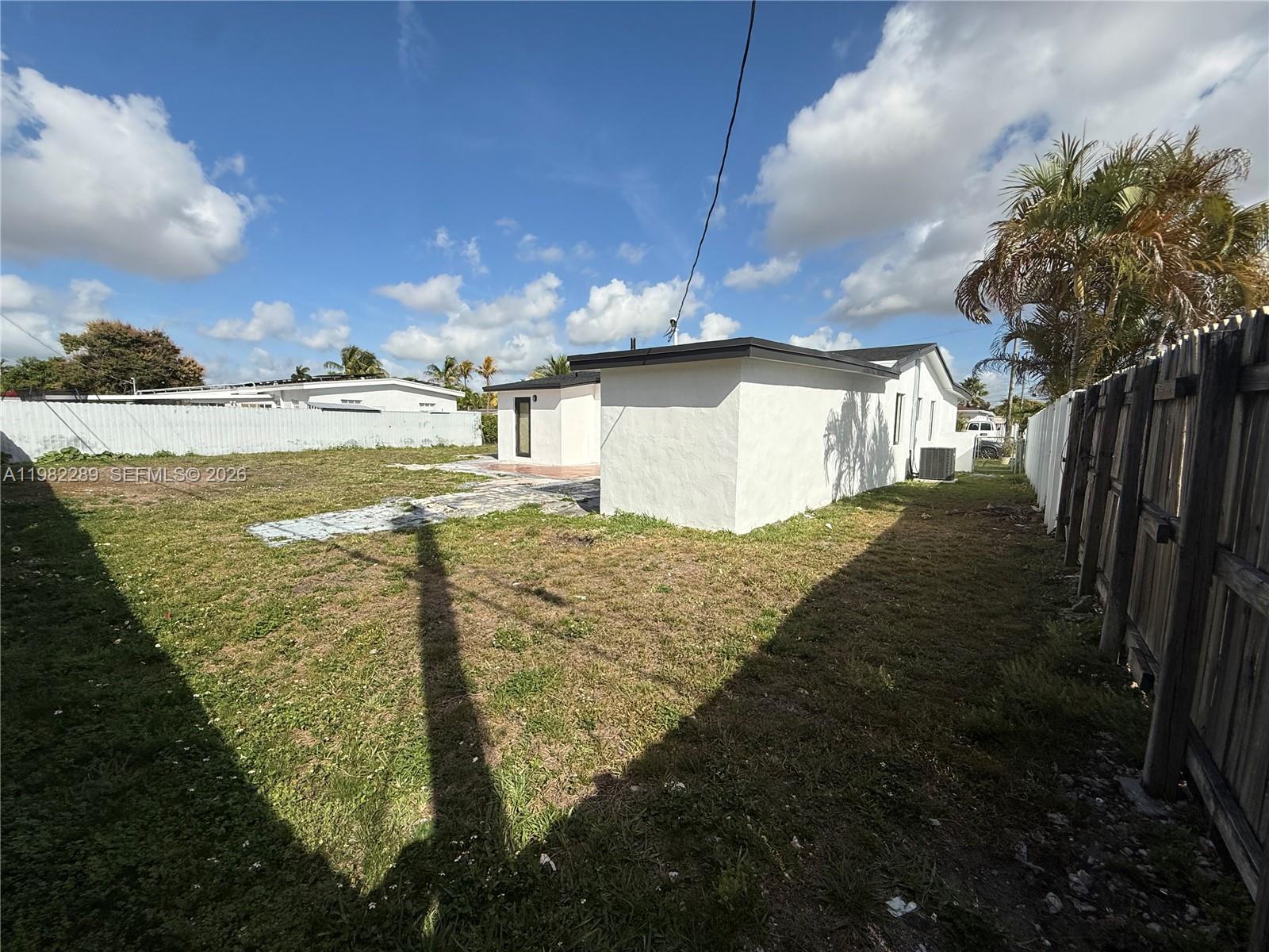 1014 West 66th Street Hialeah, FL 33012 - Photo 19 of 43 a view of a house with a yard