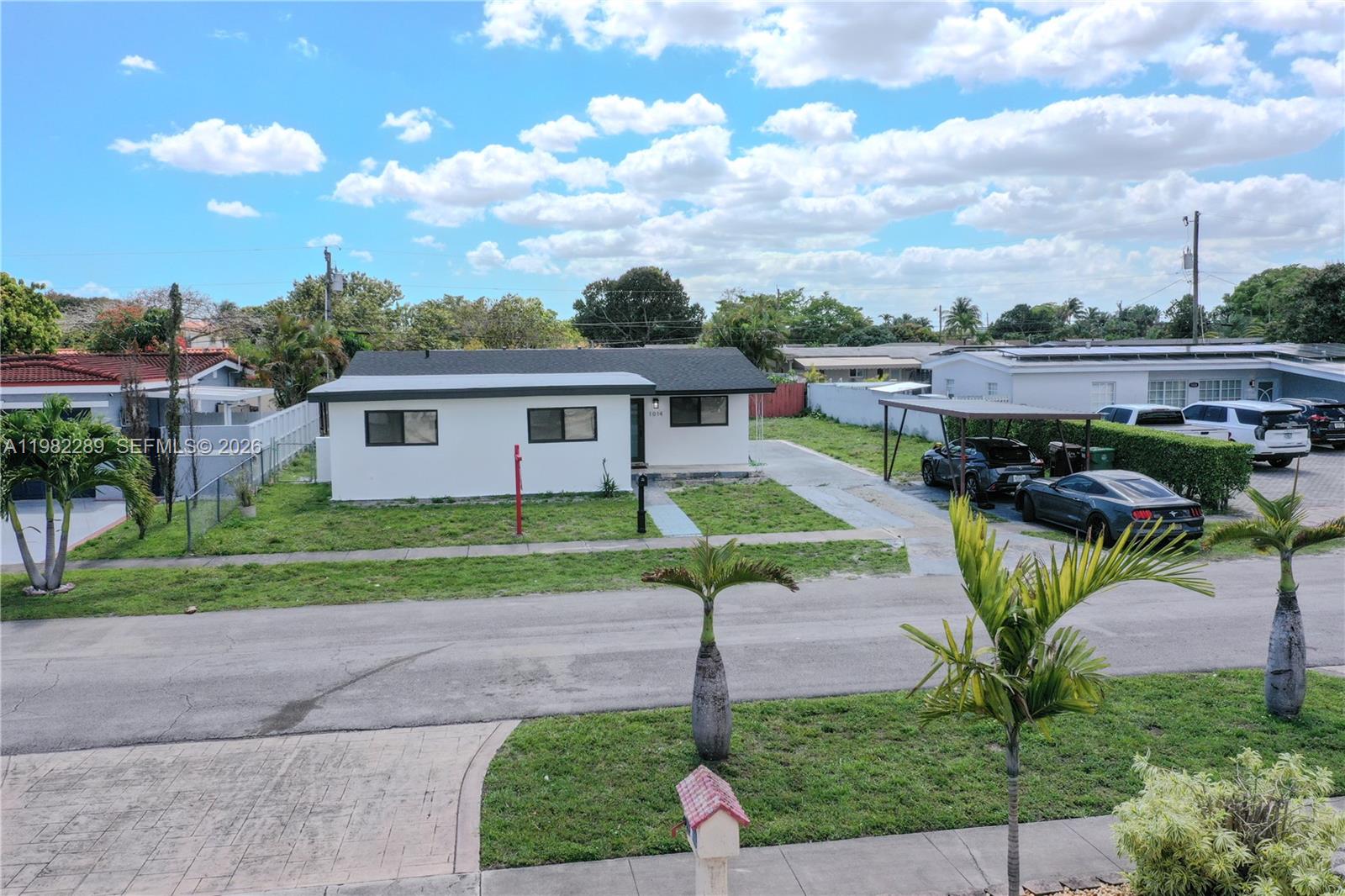 1014 West 66th Street Hialeah, FL 33012 - Photo 2 of 43 a view of a house with a backyard