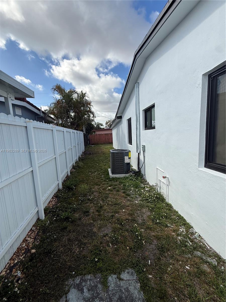 1014 West 66th Street Hialeah, FL 33012 - Photo 22 of 43 a backyard of a house with lots of green space