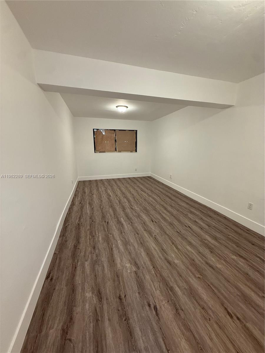 1014 West 66th Street Hialeah, FL 33012 - Photo 35 of 43 a view of empty room with wooden floor