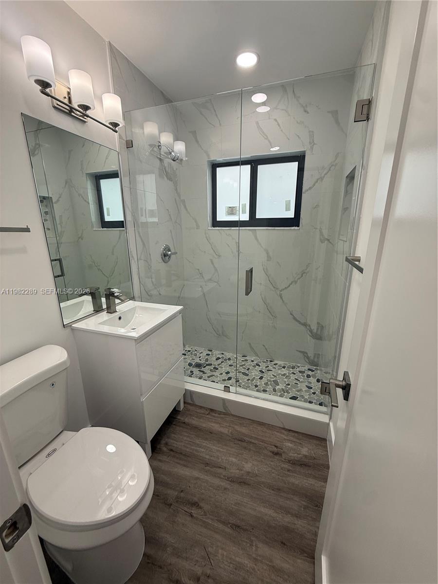 1014 West 66th Street Hialeah, FL 33012 - Photo 37 of 43 a bathroom with a toilet sink and shower