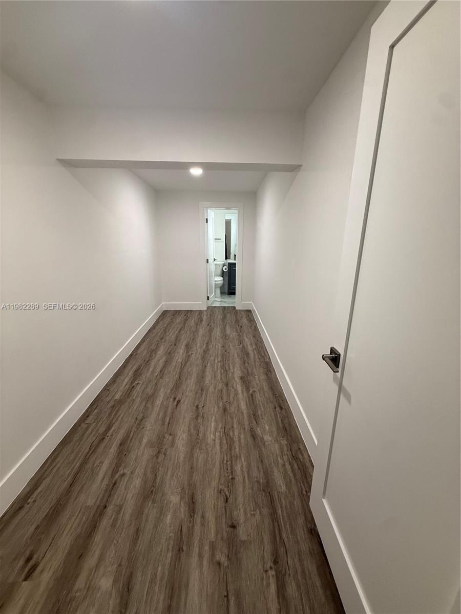 1014 West 66th Street Hialeah, FL 33012 - Photo 41 of 43 a view of empty room with wooden floor