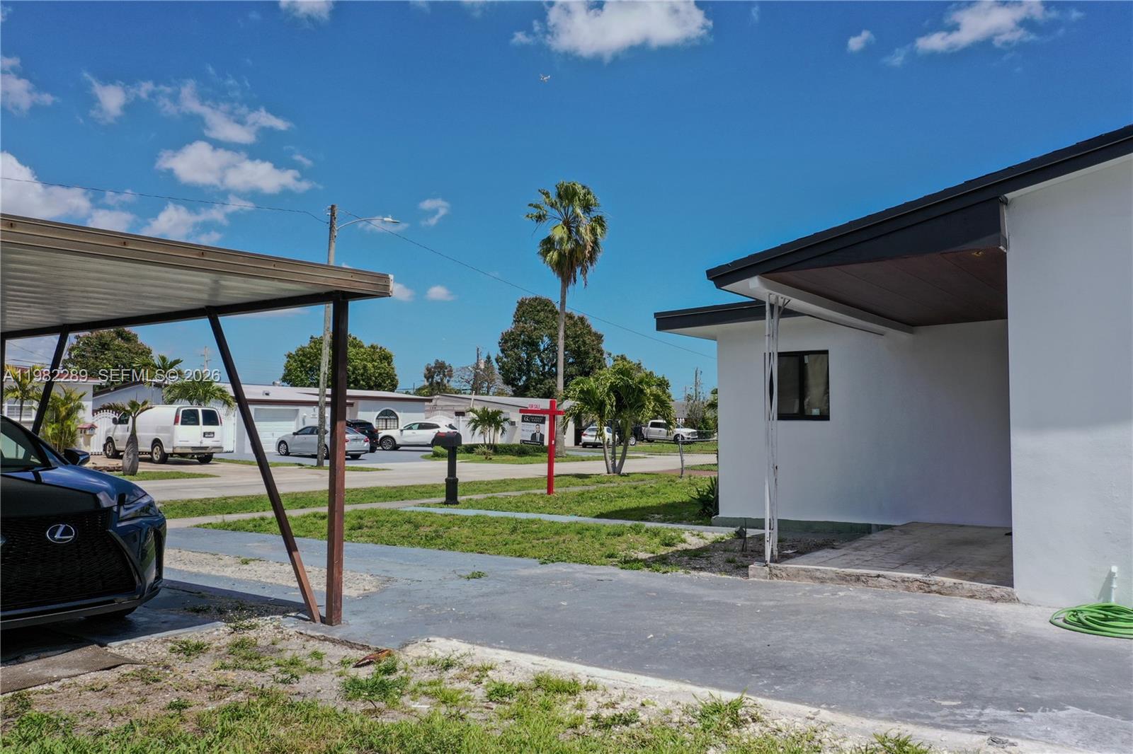 1014 West 66th Street Hialeah, FL 33012 - Photo 6 of 43 a view of a backyard with table and chairs