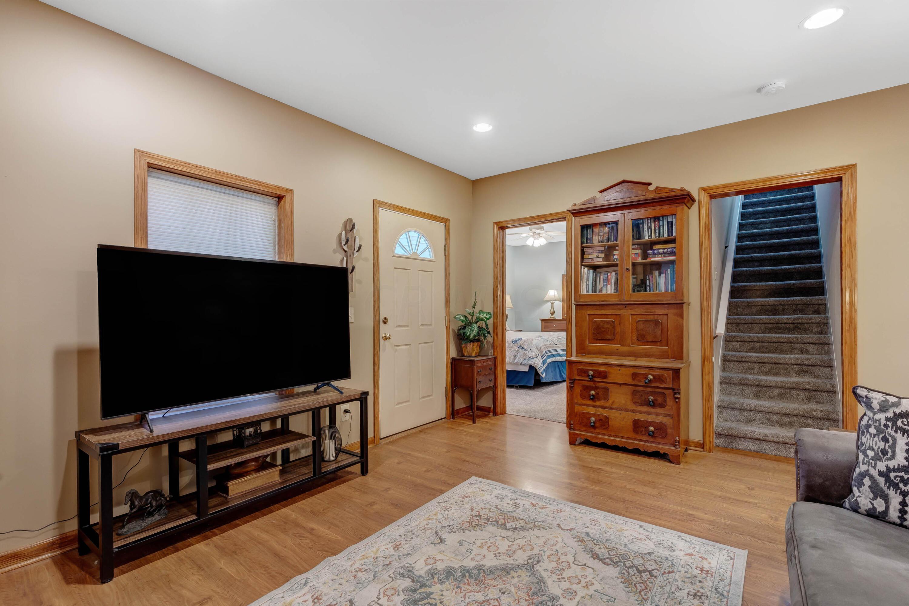 6681 Harlem Road Westerville, OH 43082 - Photo 2 of 78 • Laminate flooring • Tan painted walls • Open to Living Room
