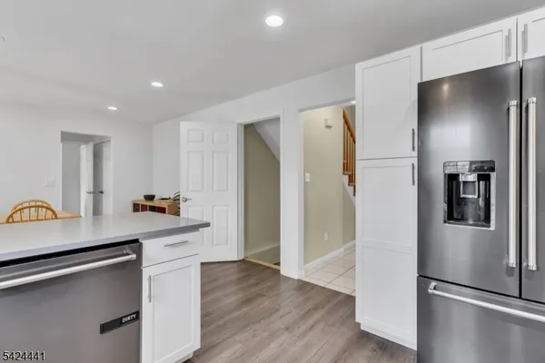 a kitchen with stainless steel appliances a refrigerator and a stove