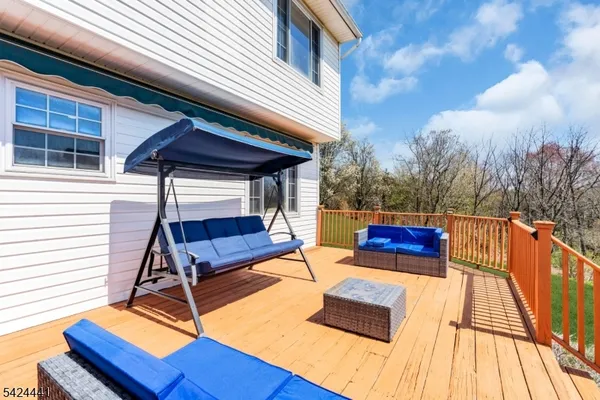 a view of sitting area with furniture and wooden deck