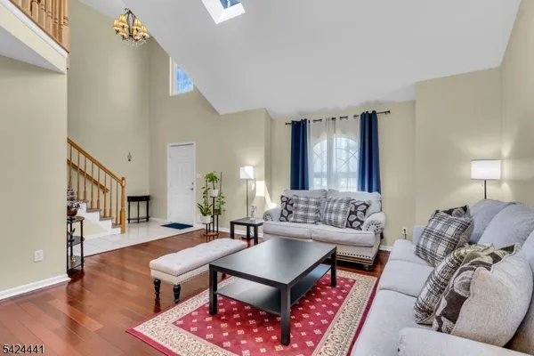 a living room with furniture rug and window