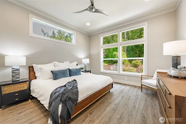 a bed room with a bed and a chair