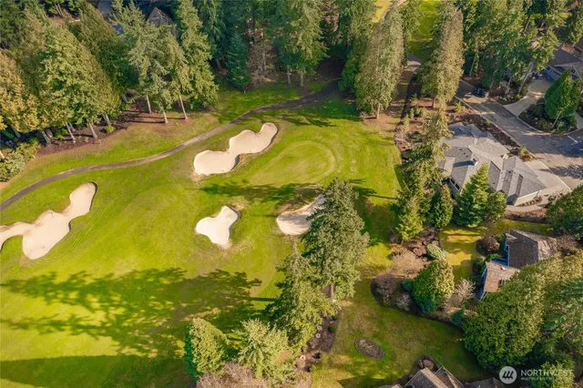 a view of a swimming pool with a yard
