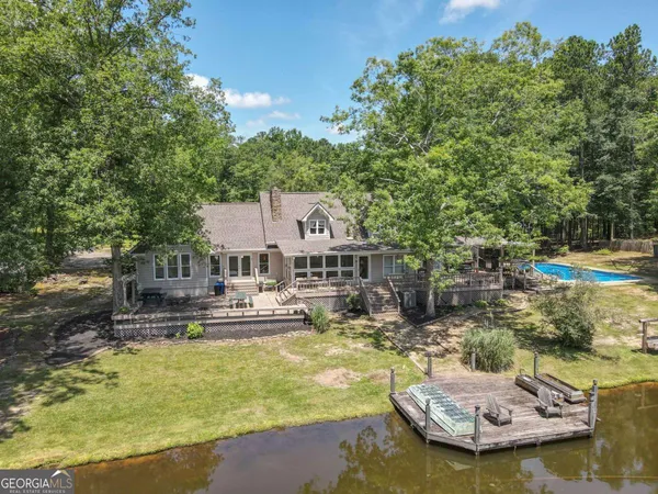 an aerial view of a house with a yard