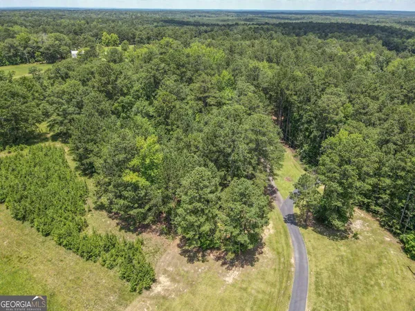 a view of a living room with furniture and a chandelier