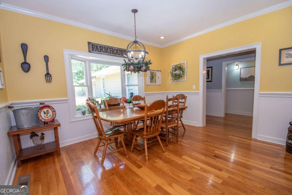 4973 Greenville Road LaGrange, GA 30241 - Photo 46 of 108 a view of a dining room with furniture and wooden floor