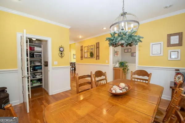 a view of a house with a yard and garage