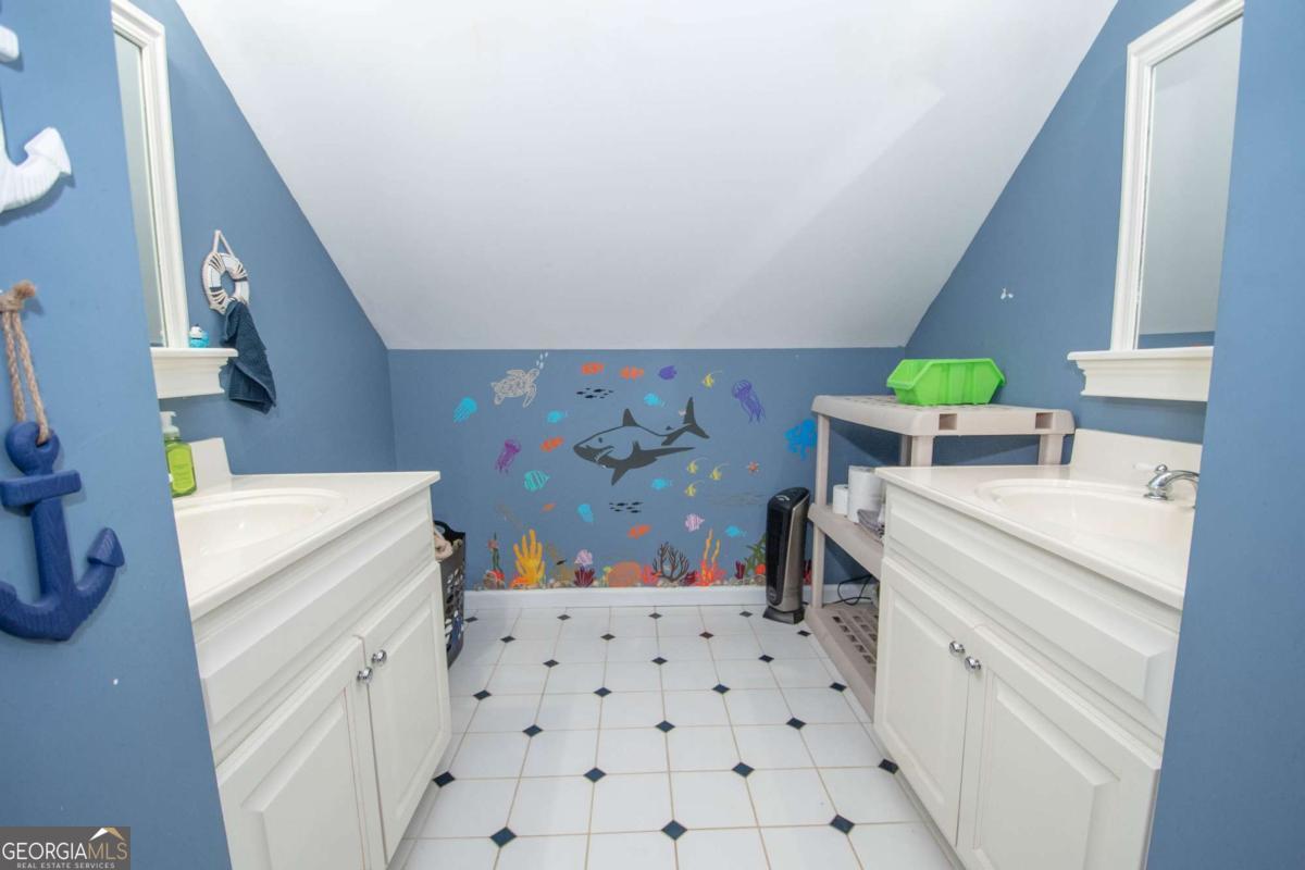 4973 Greenville Road LaGrange, GA 30241 - Photo 73 of 108 a room with a washing machine and sink