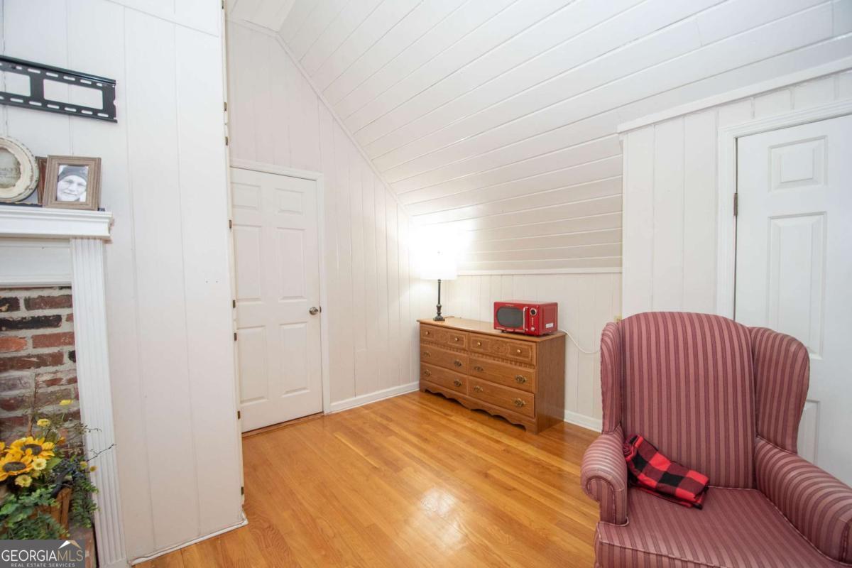 4973 Greenville Road LaGrange, GA 30241 - Photo 77 of 108 a bedroom with a bed and a couch