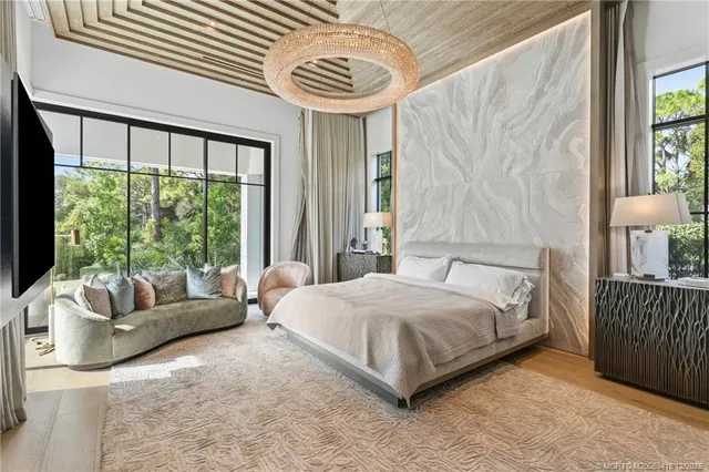 a bedroom with a bed and a television