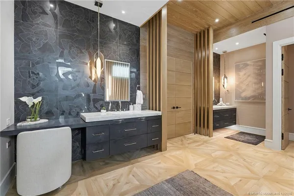 a bathroom with a double vanity sink and mirror