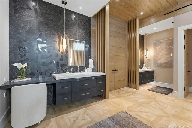 a bathroom with a double vanity sink and mirror