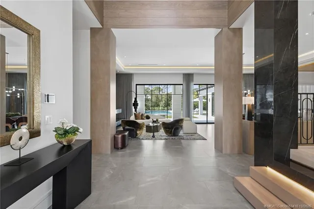 a kitchen with stainless steel appliances granite countertop a sink and a refrigerator
