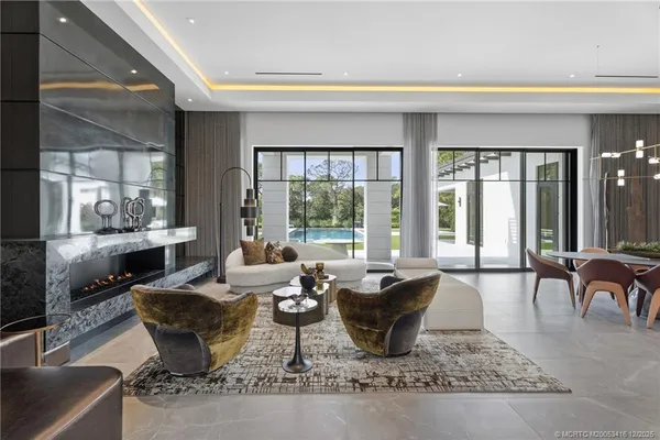 a kitchen with stainless steel appliances a sink a stove and cabinets