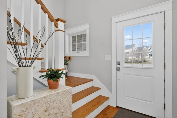 a room with table and staircase