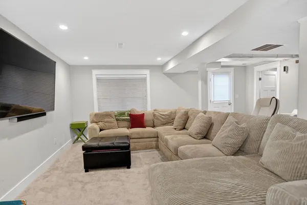 a living room with furniture and a couch