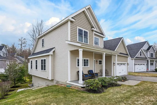 a front view of a house with a yard