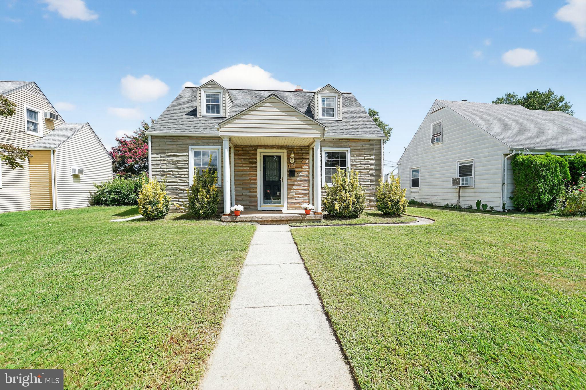 3127 Cornwall Road Baltimore, MD 21222 - Photo 1 of 24 a front view of a house with garden
