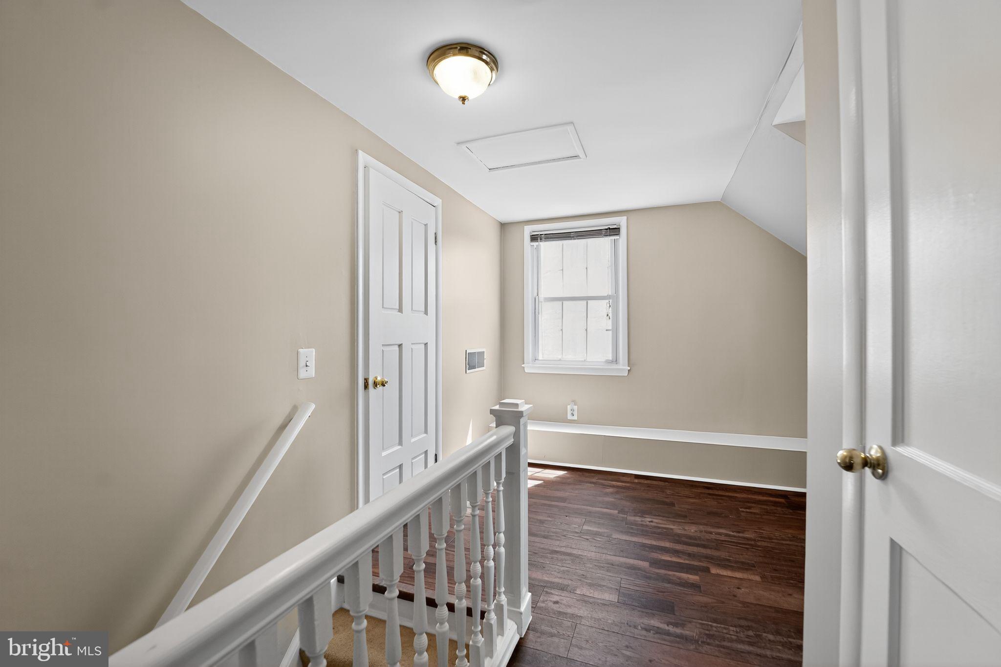 3127 Cornwall Road Baltimore, MD 21222 - Photo 16 of 24 a view of a hallway with wooden floor and staircase