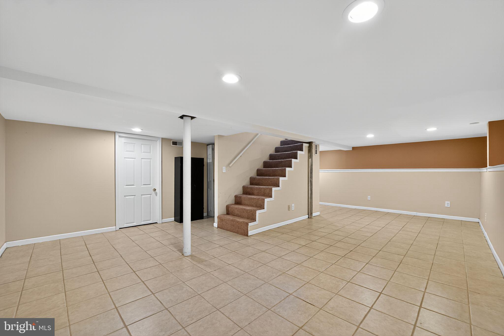 3127 Cornwall Road Baltimore, MD 21222 - Photo 20 of 24 a view of an empty room with stairs and ventilation