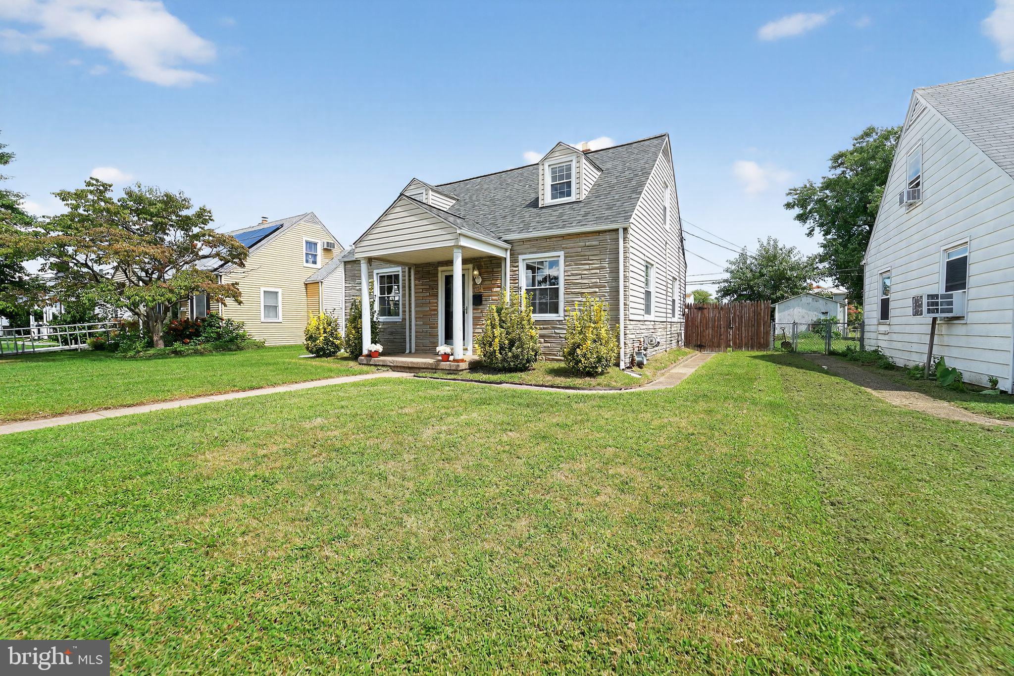 3127 Cornwall Road Baltimore, MD 21222 - Photo 2 of 24 a front view of house with yard and green space