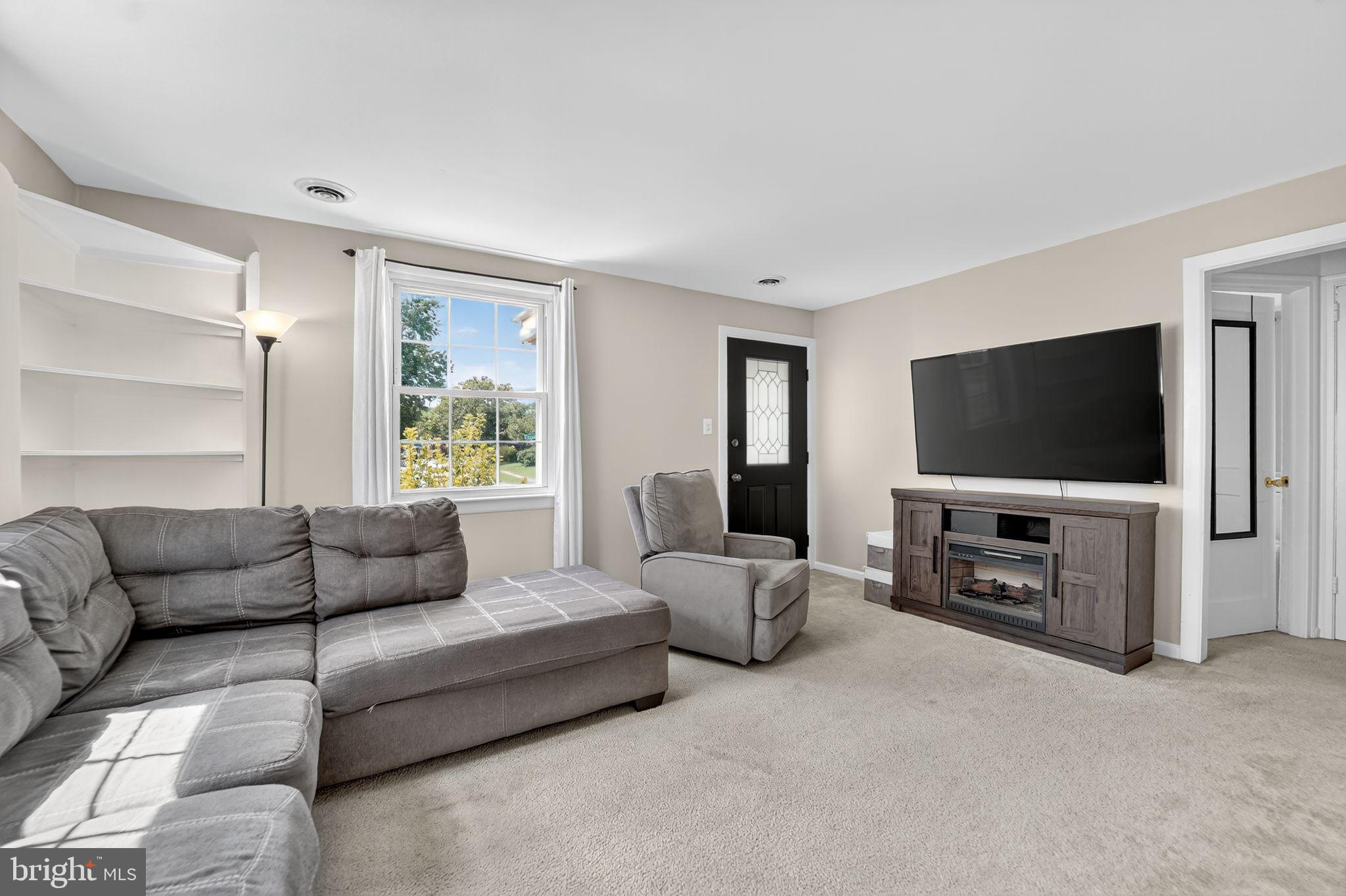 3127 Cornwall Road Baltimore, MD 21222 - Photo 5 of 24 a living room with furniture and a flat screen tv