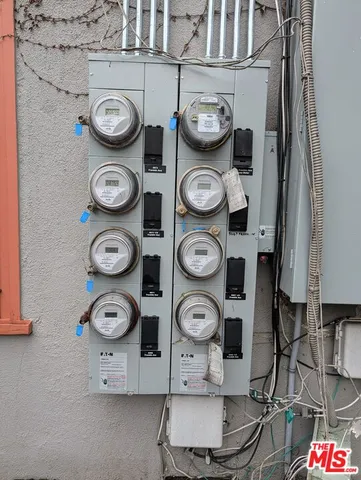 a view of a storage and utility room with wall clock