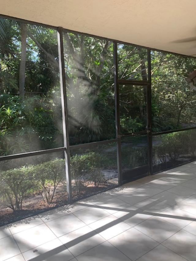 5740 Coach House Circle, Unit B Boca Raton, FL 33486 - Photo 13 of 13 large patio facing the Preserve