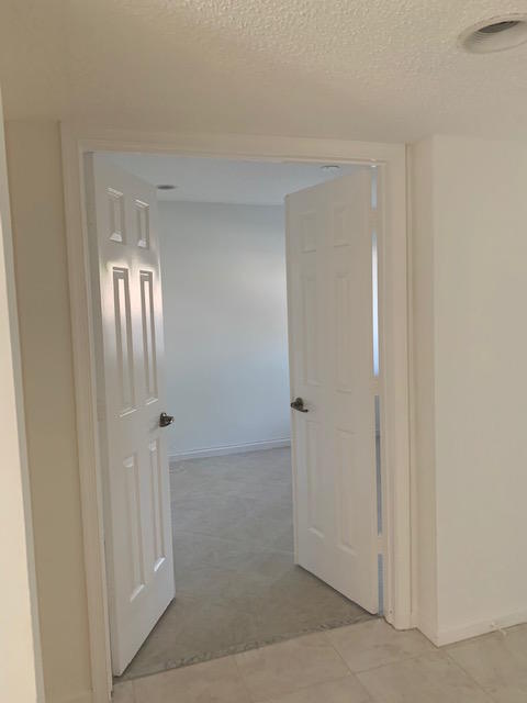 5740 Coach House Circle, Unit B Boca Raton, FL 33486 - Photo 10 of 13 Double door second bedroom