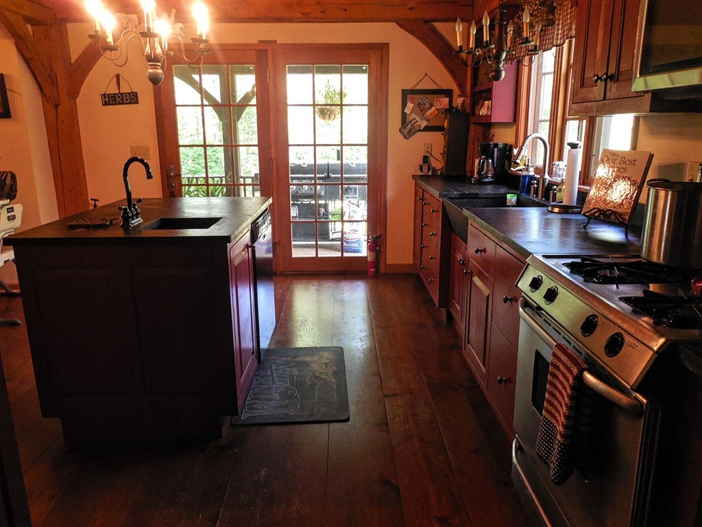 2860 Greenwich Road Hardwick, MA 01082 - Photo 12 of 28 a kitchen with stainless steel appliances a sink a stove and a wooden floors