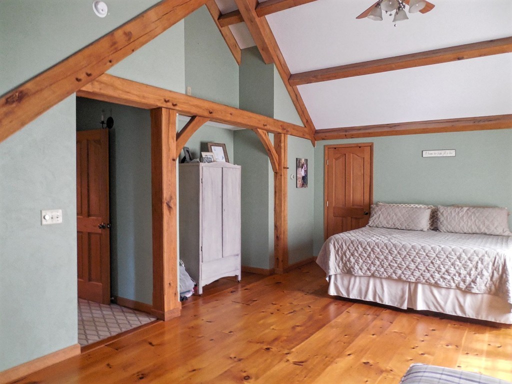 2860 Greenwich Road Hardwick, MA 01082 - Photo 19 of 28 a bedroom with a bed and a mirror