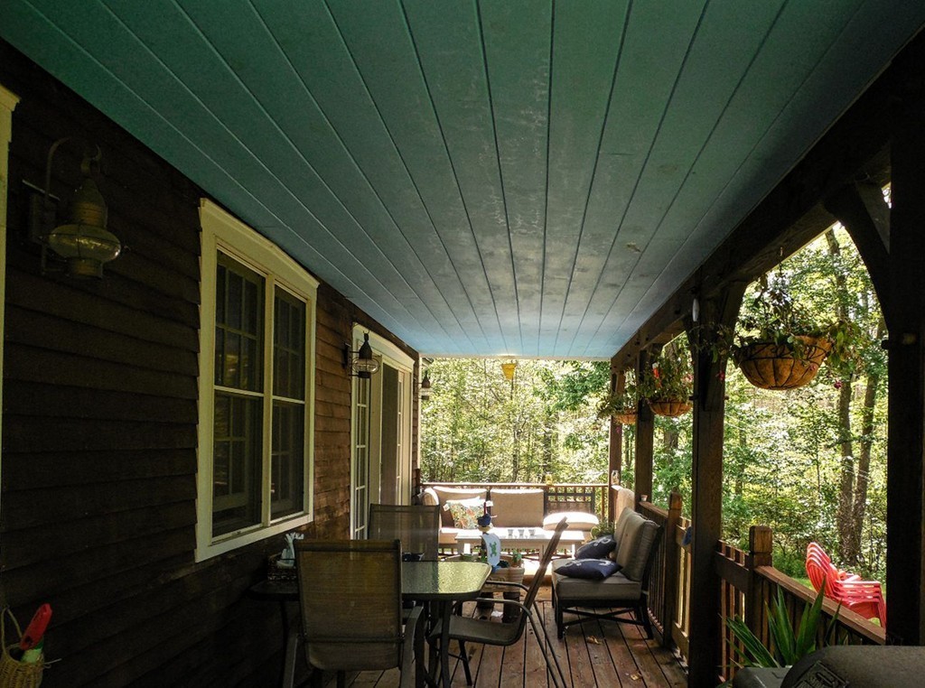 2860 Greenwich Road Hardwick, MA 01082 - Photo 23 of 28 a view of a patio with table and chairs potted plants and floor to ceiling window