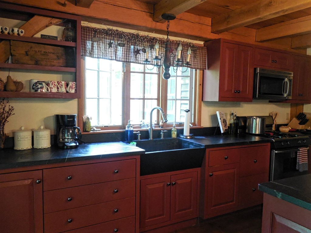 2860 Greenwich Road Hardwick, MA 01082 - Photo 9 of 28 a kitchen with granite countertop wooden cabinets a sink and a window