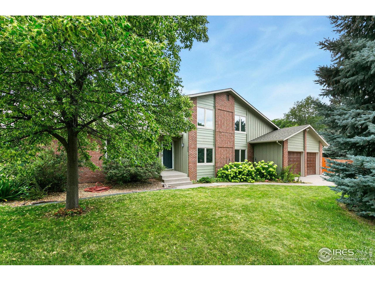 933 East Ridgecrest Road Fort Collins, CO 80524 - Photo 2 of 35 Must see 933 E Ridgecrest Rd! Charming exterior with mature trees on large lot.