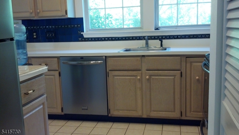 13 Wood Duck Pond Road Bedminster, NJ 07921 - Photo 6 of 13 a kitchen with a sink and cabinets