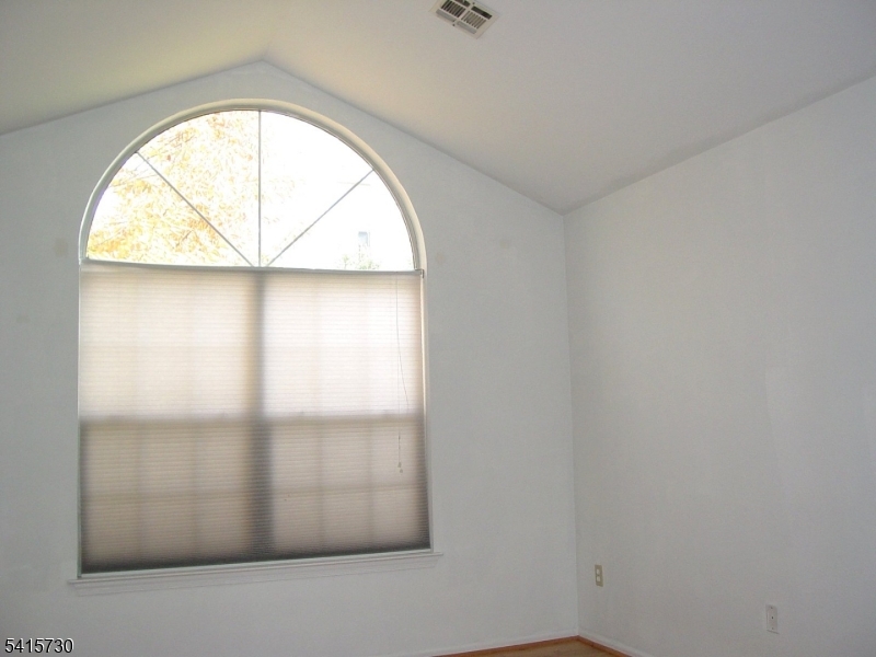 13 Wood Duck Pond Road Bedminster, NJ 07921 - Photo 9 of 13 an empty room with a window