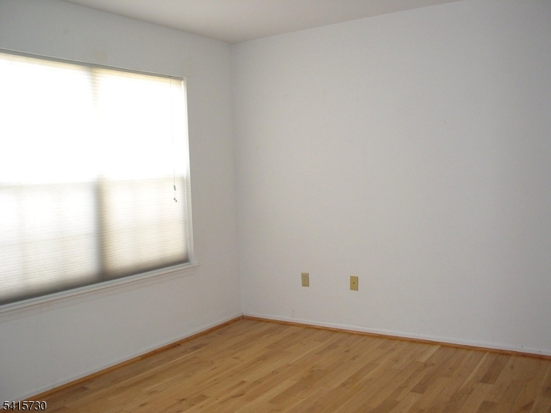 13 Wood Duck Pond Road Bedminster, NJ 07921 - Photo 10 of 13 a view of an empty room and window