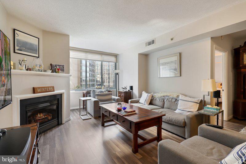 851 North Glebe Road, Unit 520 Arlington, VA 22203 - Photo 2 of 28 a living room with furniture fireplace and window