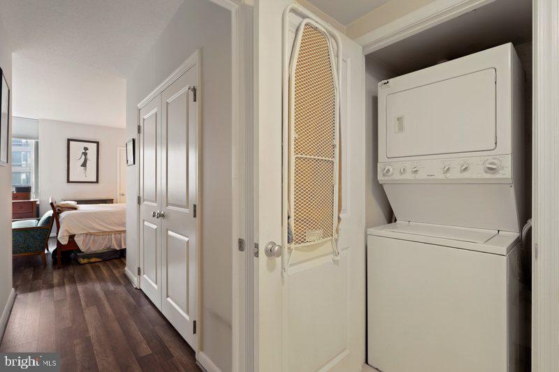 851 North Glebe Road, Unit 520 Arlington, VA 22203 - Photo 15 of 28 a view of a bedroom with a bed and wooden floor