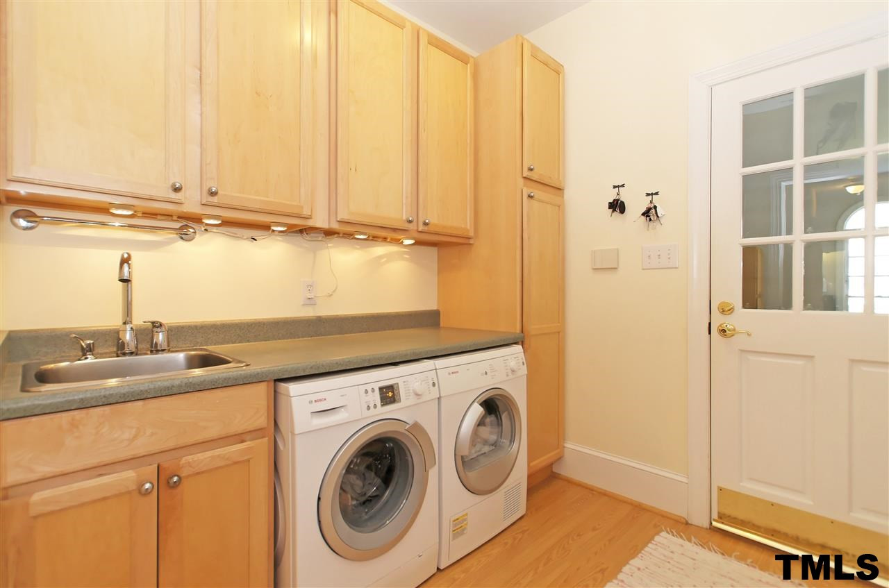 2321 Primrose Valley Court Raleigh, NC 27613 - Photo 18 of 24 SEPARATE LAUNDRY ROOM WITH SINK AND LOTS OF CABINETS & COUNTER SPACE! Laundry