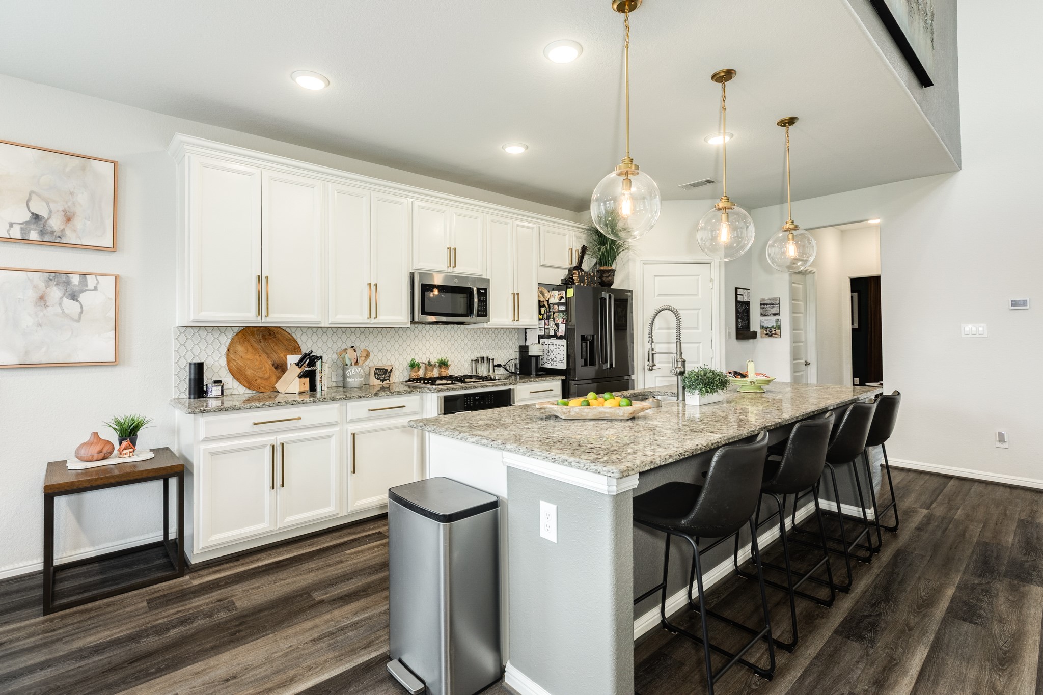 10306 Aldrin Drive Rosharon, TX 77583 - Photo 13 of 50 This view highlights the ample cabinet storage and comfortable seating area for bar stools.