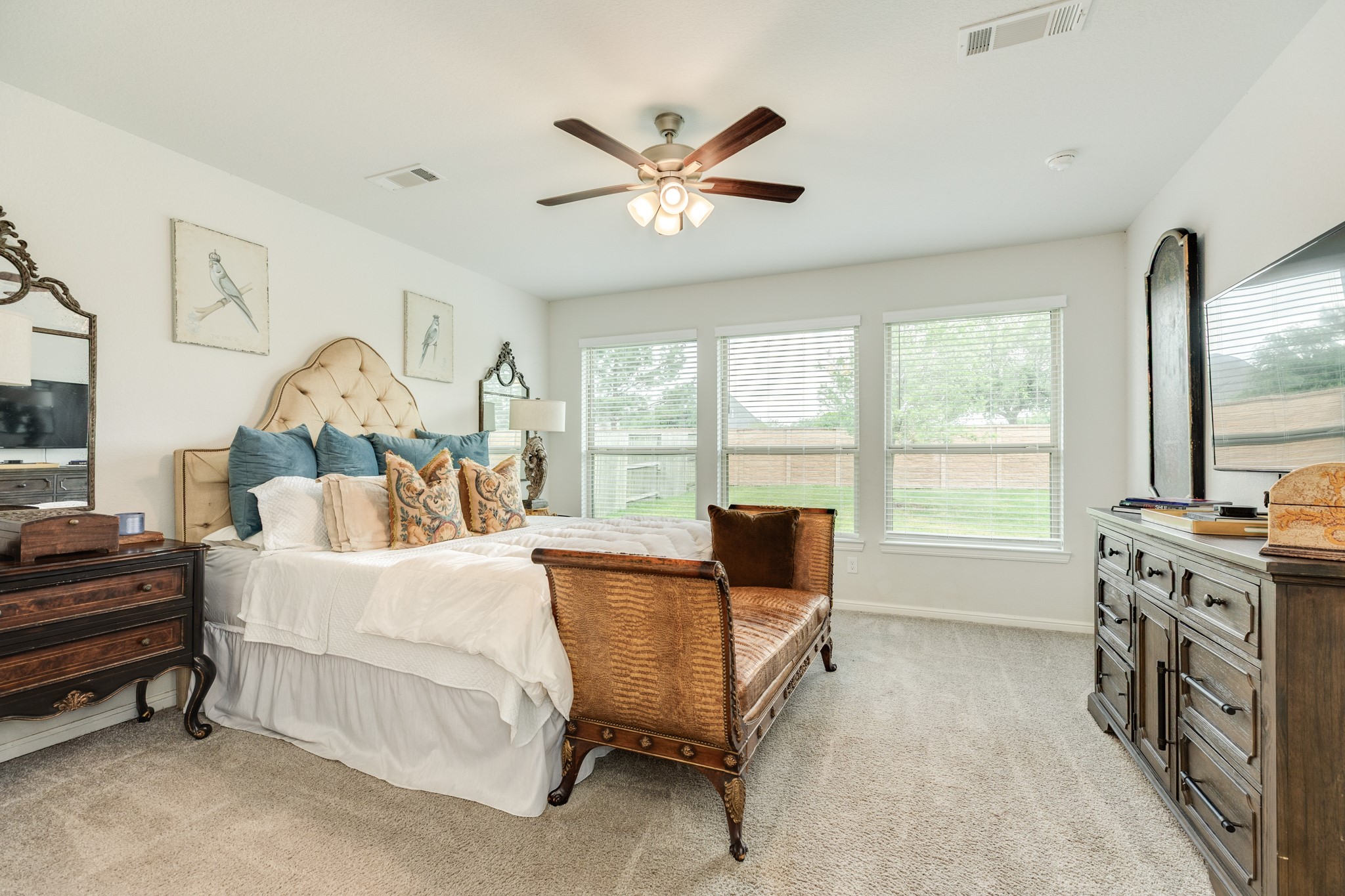 10306 Aldrin Drive Rosharon, TX 77583 - Photo 16 of 50 The primary bedroom, located on the first floor, features a backyard view with no rear neighbors. The room is exceptionally spacious and well-lit, boasting numerous windows.