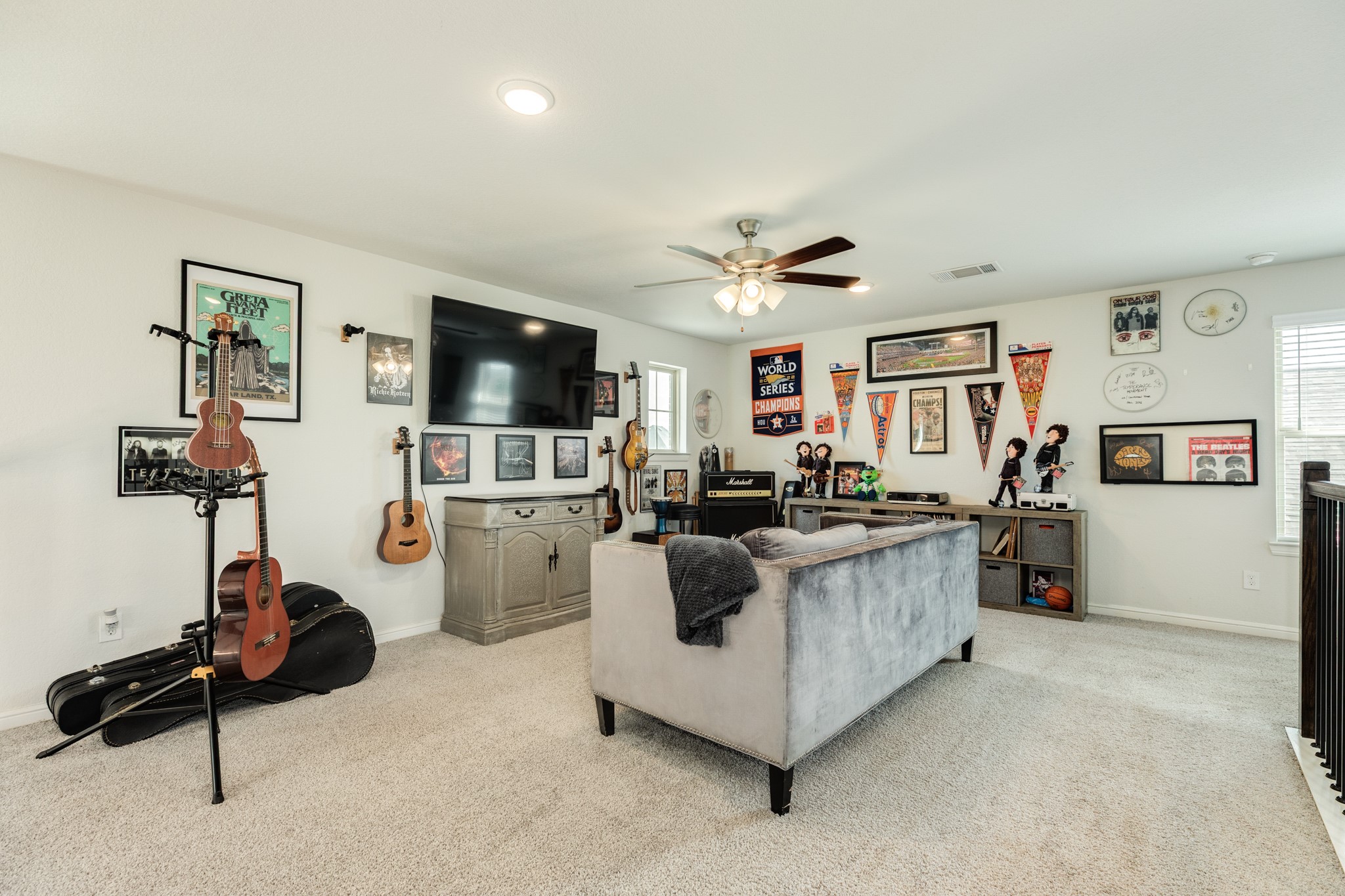10306 Aldrin Drive Rosharon, TX 77583 - Photo 23 of 50 The game room features like-new carpeting and oversized windows, allowing for ample natural light.