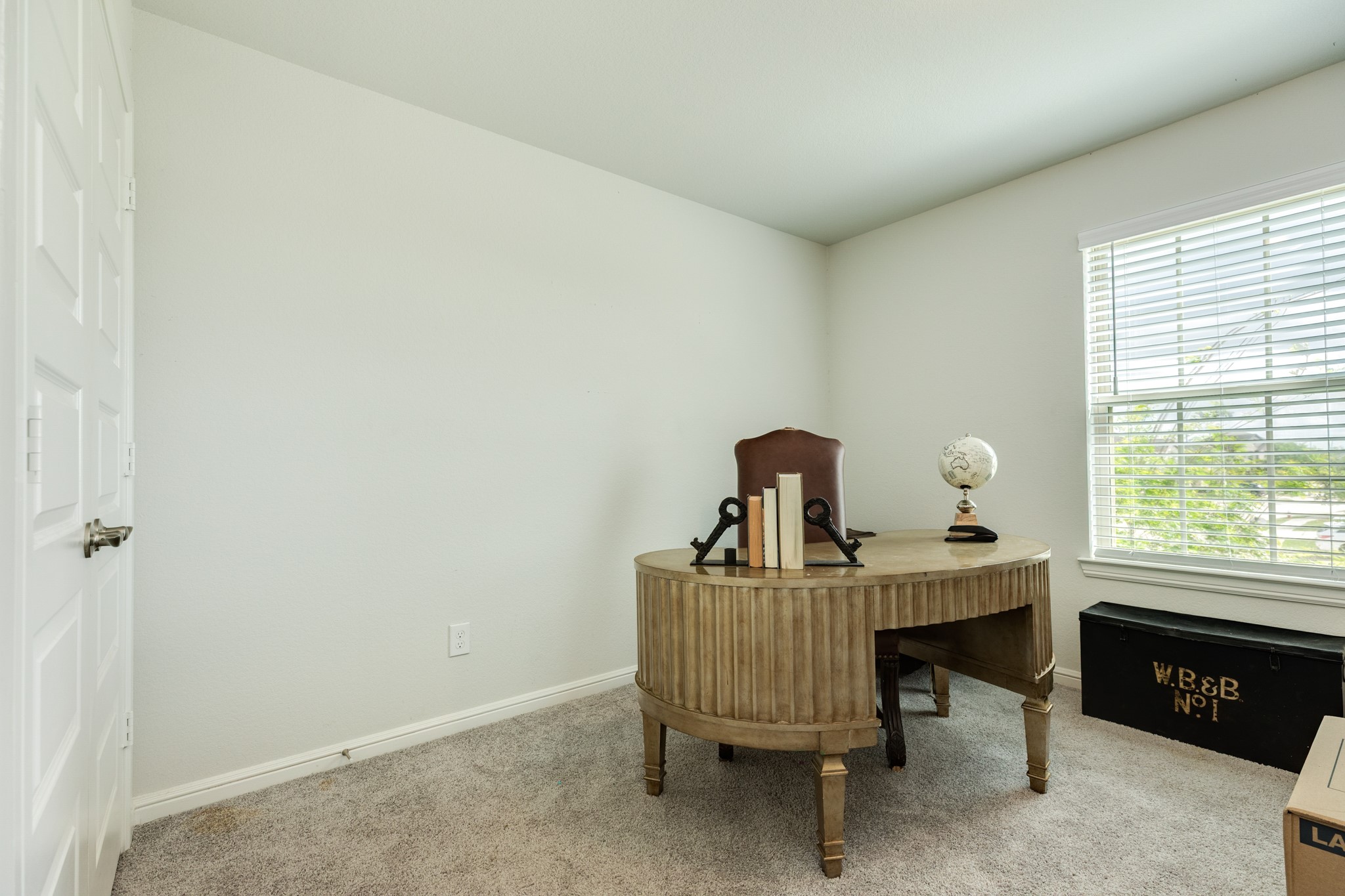 10306 Aldrin Drive Rosharon, TX 77583 - Photo 24 of 50 Upstairs secondary bedroom featuring an oversized window overlooking the street, complete with quality carpeting and a spacious closet.
